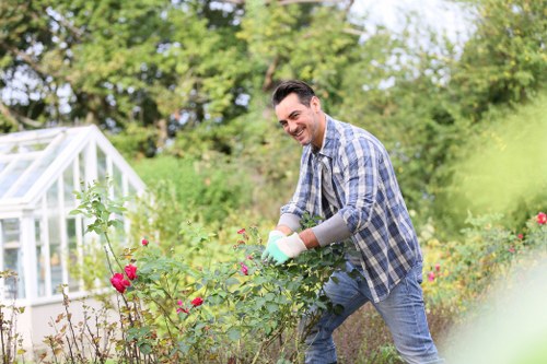 Team member carrying out insured garden maintenance
